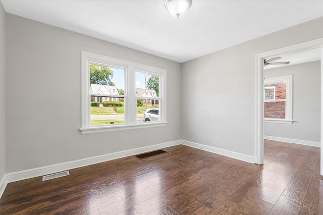 8908 Apache Ln, Overland, MO 63114 - unfurnished room featuring wood finished floors and baseboards