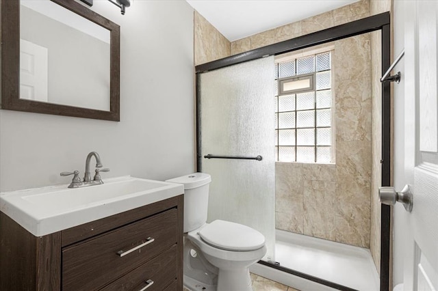 8908 Apache Ln, Overland, MO 63114 - bathroom with a shower stall, toilet, and vanity