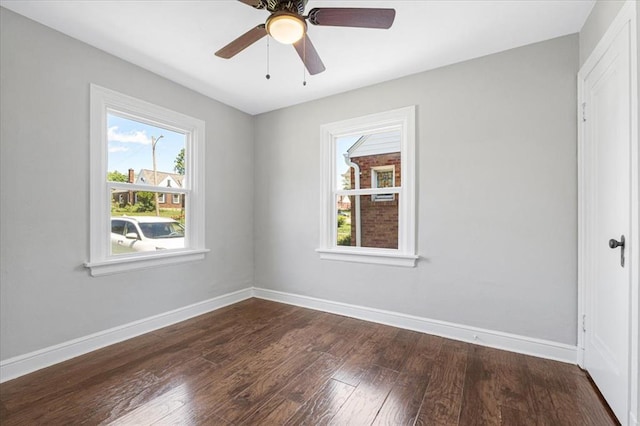 8908 Apache Ln, Overland, MO 63114 - unfurnished room with dark wood finished floors, baseboards, and ceiling fan