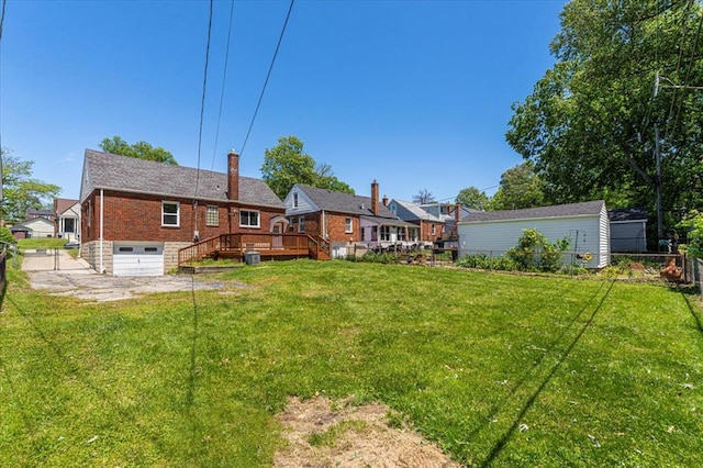 8908 Apache Ln, Overland, MO 63114 - view of yard with a garage and a deck