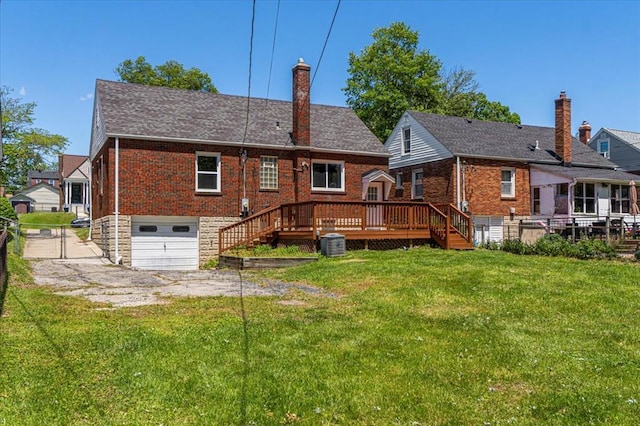 8908 Apache Ln, Overland, MO 63114 - back of house with a garage, a chimney, brick siding, central air condition unit, and a deck