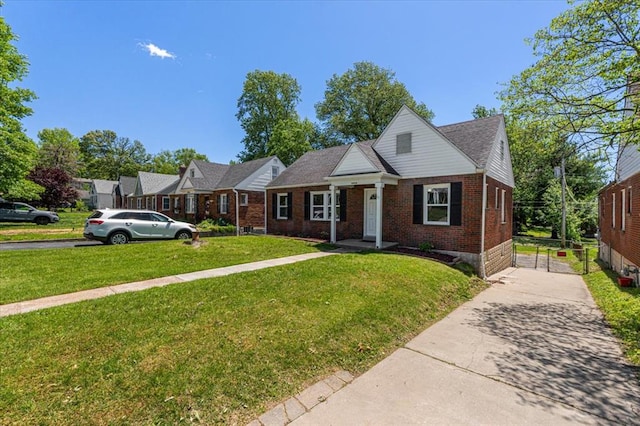 8908 Apache Ln, Overland, MO 63114 - bungalow-style home featuring concrete driveway, brick siding, and a front yard