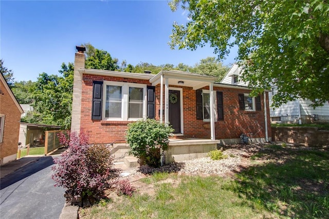 1104 Douglas St, Alton, IL 62002 - view of front of home with brick siding and a chimney
