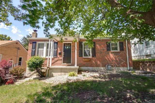 1104 Douglas St, Alton, IL 62002 - view of front of property featuring brick siding and a chimney