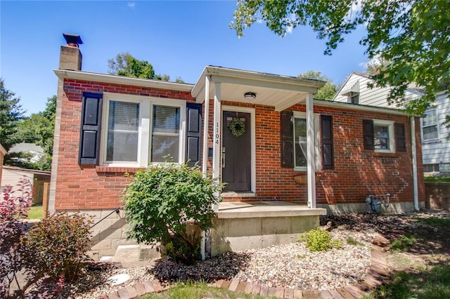 1104 Douglas St, Alton, IL 62002 - view of front of home with brick siding and a chimney