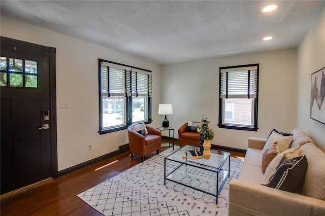 1104 Douglas St, Alton, IL 62002 - living area featuring wood finished floors, healthy amount of natural light, recessed lighting, baseboards, and a textured ceiling