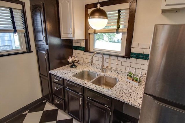 1104 Douglas St, Alton, IL 62002 - kitchen featuring freestanding refrigerator, a sink, healthy amount of natural light, and tile patterned floors
