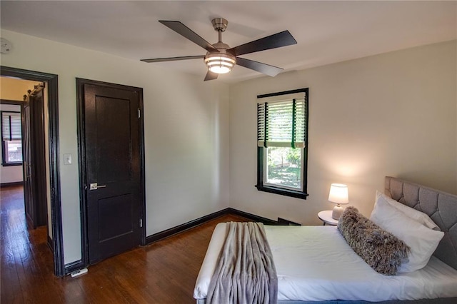 1104 Douglas St, Alton, IL 62002 - bedroom featuring dark wood-style flooring, baseboards, and a ceiling fan
