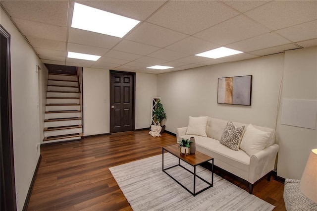 1104 Douglas St, Alton, IL 62002 - living area featuring stairs, dark wood-style floors, a paneled ceiling, and baseboards