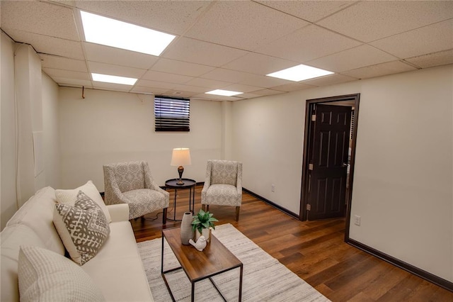 1104 Douglas St, Alton, IL 62002 - living area featuring wood finished floors, a drop ceiling, and baseboards