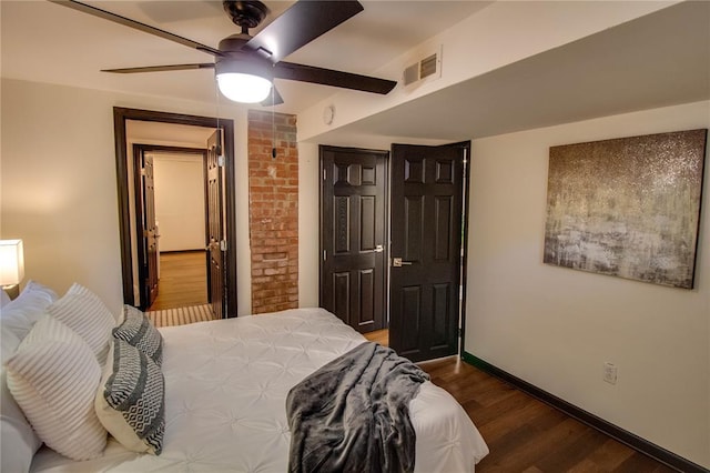 1104 Douglas St, Alton, IL 62002 - bedroom with wood finished floors, a ceiling fan, and baseboards