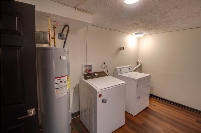 1104 Douglas St, Alton, IL 62002 - washroom with electric water heater, washer and clothes dryer, wood finished floors, a textured ceiling, and baseboards