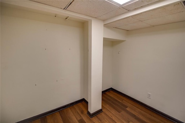 1104 Douglas St, Alton, IL 62002 - finished basement featuring dark wood finished floors, baseboards, and a drop ceiling