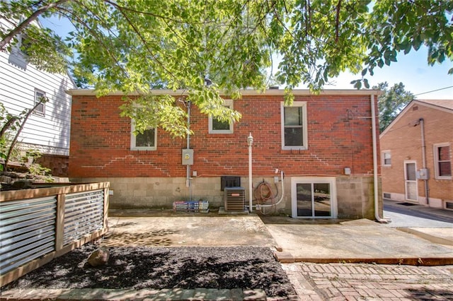 1104 Douglas St, Alton, IL 62002 - back of house with brick siding, a patio, and central AC
