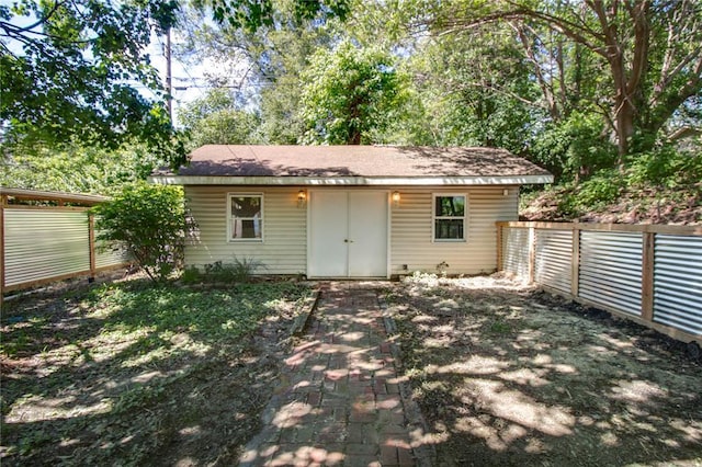 1104 Douglas St, Alton, IL 62002 - back of property with a fenced backyard and an outdoor structure