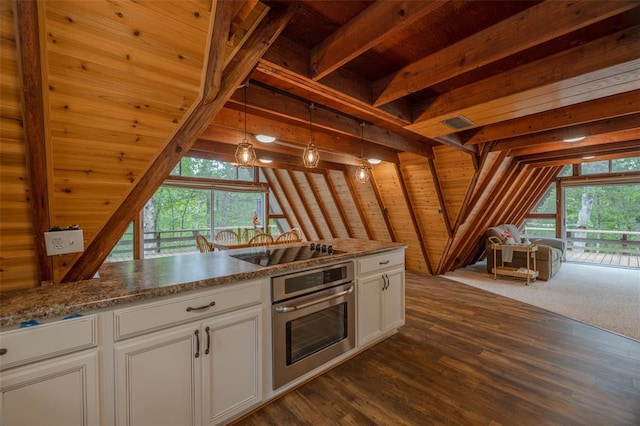 84 E Altdorf Dr, Innsbrook, MO 63390 - kitchen with stainless steel oven, black electric stovetop, vaulted ceiling, dark wood-style flooring, and decorative light fixtures
