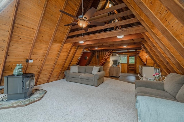 84 E Altdorf Dr, Innsbrook, MO 63390 - living area with wooden walls, a wood stove, stairs, ceiling fan, and wooden ceiling