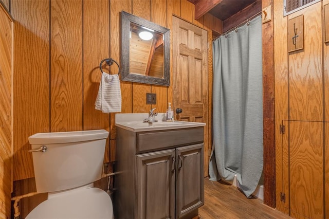 84 E Altdorf Dr, Innsbrook, MO 63390 - full bath featuring wooden walls, toilet, vanity, wood finished floors, and a shower with curtain