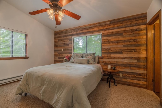 84 E Altdorf Dr, Innsbrook, MO 63390 - carpeted bedroom featuring wood walls, a baseboard radiator, and ceiling fan