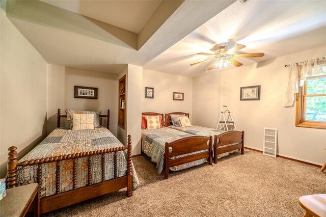 carpeted bedroom with baseboards and a ceiling fan