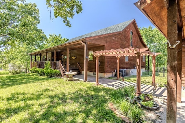 back of property with a pergola, cooling unit, a patio, and roof with shingles