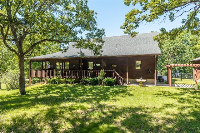 back of house featuring a lawn, a deck, and central air condition unit