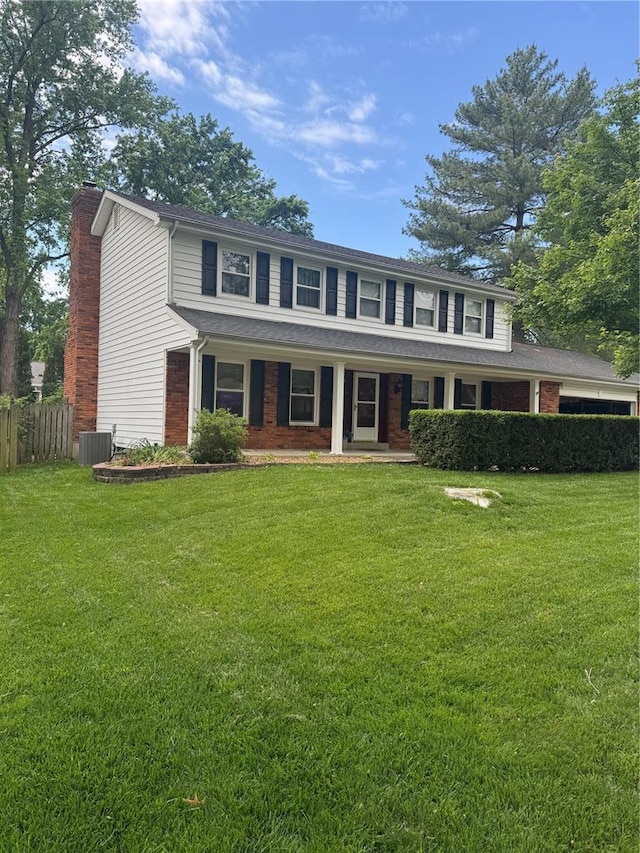 15792 Scenic Green Ct, Chesterfield, MO 63017 - view of front of property with central AC, covered porch, a chimney, and brick siding