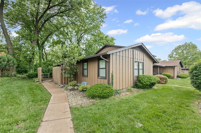 1404 Hampton Ct, Belleville, IL 62223 - view of side of property with a yard and board and batten siding