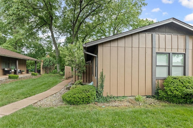 1404 Hampton Ct, Belleville, IL 62223 - view of side of home with a lawn and board and batten siding