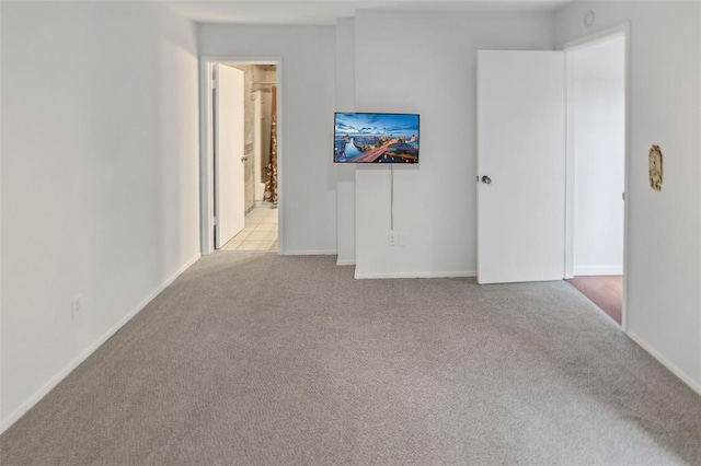 1404 Hampton Ct, Belleville, IL 62223 - unfurnished living room with light colored carpet and baseboards