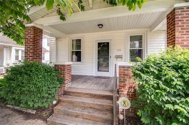 210 W Elm St, Alton, IL 62002 - view of exterior entry with a porch and brick siding