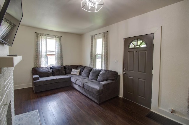 210 W Elm St, Alton, IL 62002 - living room featuring healthy amount of natural light, dark wood-type flooring, and baseboards