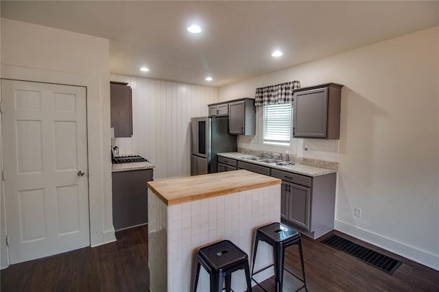 210 W Elm St, Alton, IL 62002 - kitchen with stainless steel fridge, wooden counters, dark wood-style floors, a sink, and recessed lighting
