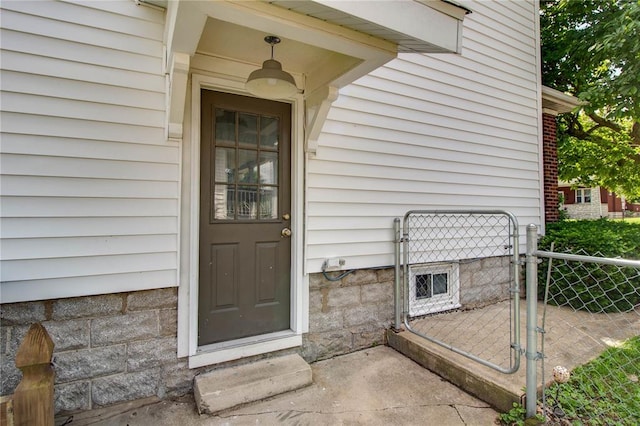 210 W Elm St, Alton, IL 62002 - view of exterior entry featuring a gate