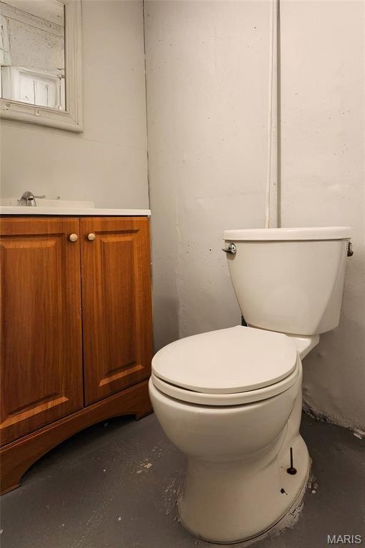 1321 Highmont Dr, Saint Louis, MO 63135 - half bath with vanity and concrete flooring