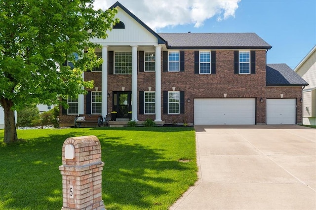 5 The Crossings Ct, Ofallon, MO 63366 - neoclassical home featuring driveway, a front lawn, and brick siding