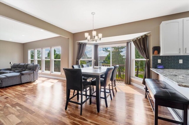 5 The Crossings Ct, Ofallon, MO 63366 - dining room featuring a chandelier, light wood finished floors, baseboards, and recessed lighting