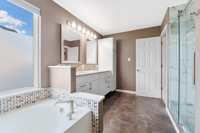 5 The Crossings Ct, Ofallon, MO 63366 - bathroom with vanity, a bath, a marble finish shower, marble finish flooring, and backsplash