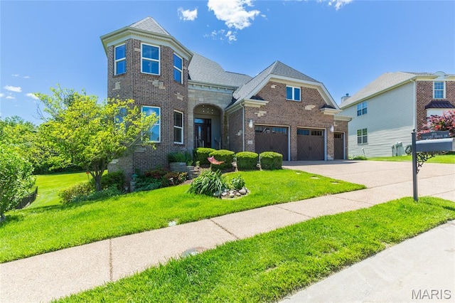 106 Tuscany Trace Dr, Saint Charles, MO 63303 - view of front of property featuring concrete driveway, brick siding, a front lawn, and a garage