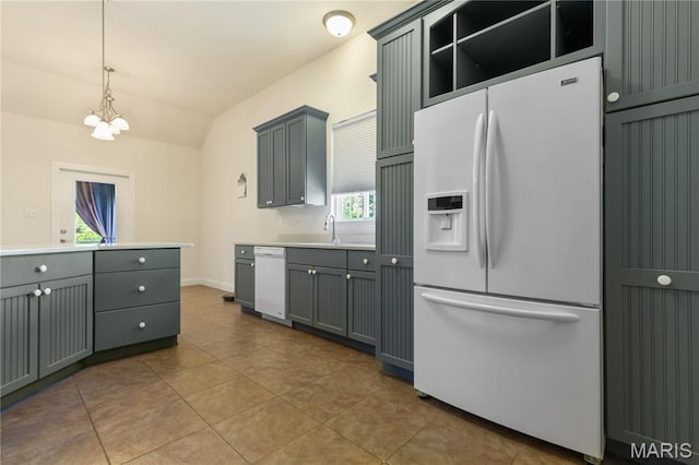 106 Tuscany Trace Dr, Saint Charles, MO 63303 - kitchen with white appliances, tile patterned flooring, lofted ceiling, light countertops, and a chandelier