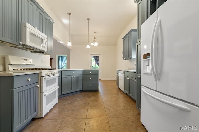 106 Tuscany Trace Dr, Saint Charles, MO 63303 - kitchen with white appliances, a chandelier, gray cabinetry, light countertops, and vaulted ceiling