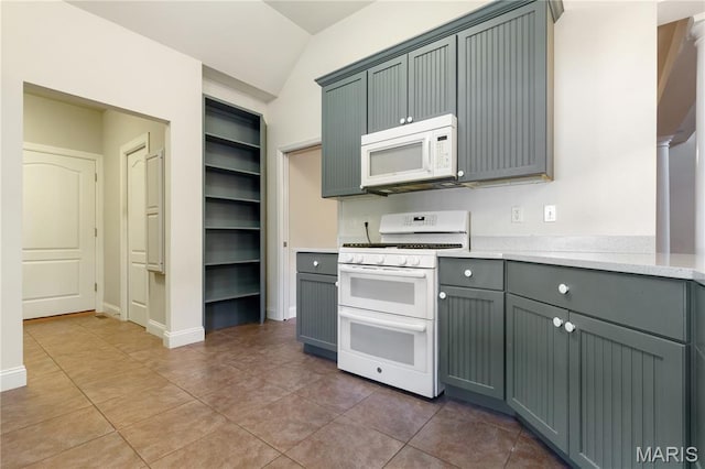 106 Tuscany Trace Dr, Saint Charles, MO 63303 - kitchen with white appliances, light tile patterned floors, vaulted ceiling, gray cabinets, and open shelves