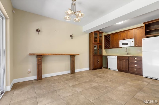 106 Tuscany Trace Dr, Saint Charles, MO 63303 - kitchen with white appliances, a sink, light countertops, open shelves, and a chandelier