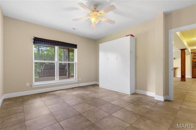 106 Tuscany Trace Dr, Saint Charles, MO 63303 - empty room with tile patterned floors, ceiling fan, and baseboards