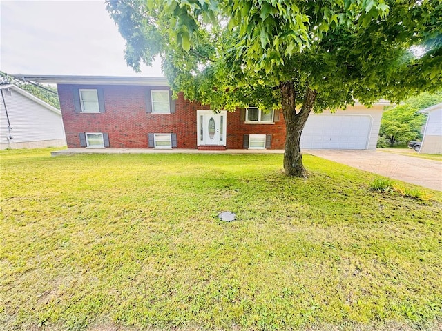 1202 S Mildred Ave, Salem, MO 65560 - view of front of home with brick siding, a front lawn, driveway, and a garage