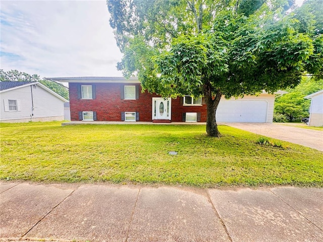 1202 S Mildred Ave, Salem, MO 65560 - raised ranch featuring concrete driveway, a front yard, brick siding, and an attached garage