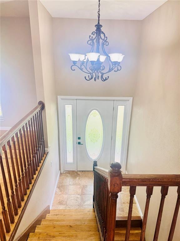 1202 S Mildred Ave, Salem, MO 65560 - foyer with a chandelier, a towering ceiling, baseboards, and stairs