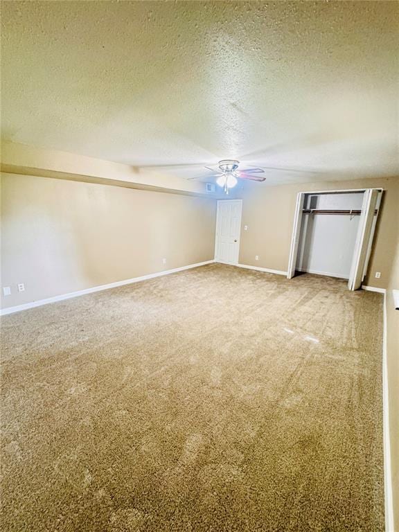 1202 S Mildred Ave, Salem, MO 65560 - unfurnished bedroom featuring carpet floors, a textured ceiling, baseboards, and a ceiling fan