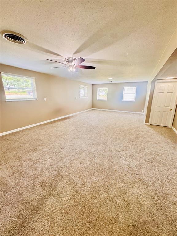 1202 S Mildred Ave, Salem, MO 65560 - carpeted empty room with a textured ceiling, baseboards, and ceiling fan