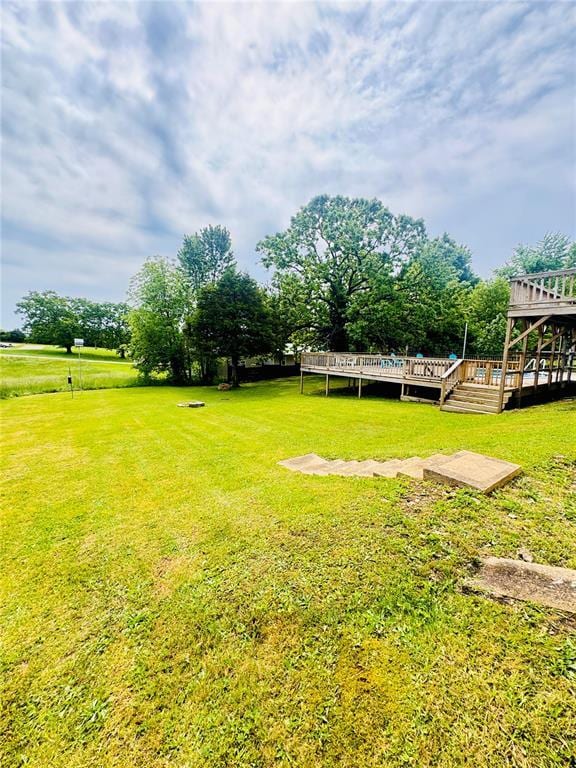 1202 S Mildred Ave, Salem, MO 65560 - view of grassy yard featuring a deck and stairway